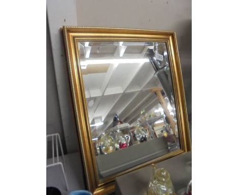 A gilt framed bevel edged mirror, 49 x 60 cm.