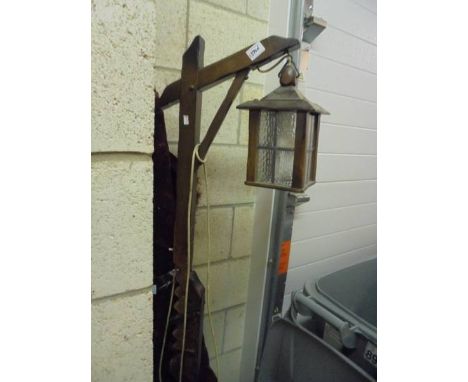 A vintage wooden floor lamp.