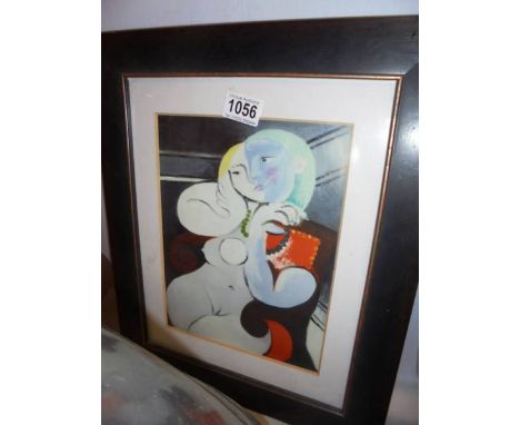 A framed and glazed print in the style of Picasso.