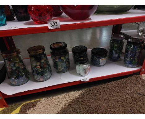 8 Jars of colourful marbles 