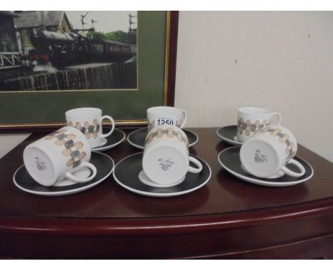Six Susie Cooper coffee cups and saucers.