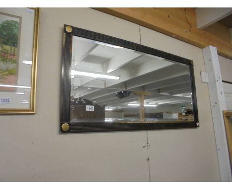 A gilt framed bevel edged mirror.