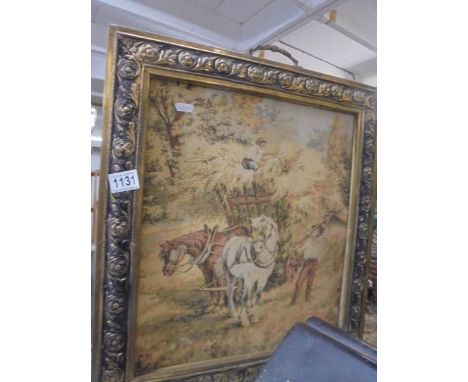 An old brass fire screen with tapestry inset.
