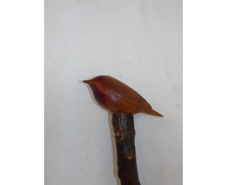 Wooden walking stick with carved handle in form of a robin