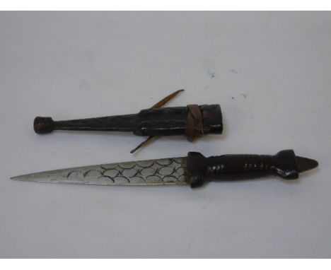 Antique sock dirk with original scabbard trappening tool to hilt and engraved blade. Approx 7''