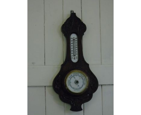Carved oak barometer
