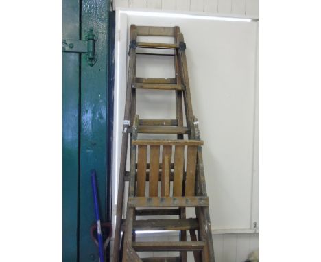 Antique wooden ladder and a pair of vintage wooden steps