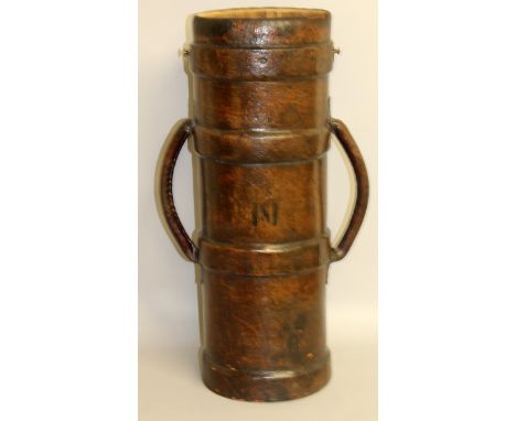 A MILITARY LEATHER BOUND SHELL CARRIER with handles, stamped JAN Arrow 11. 28ins high