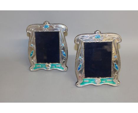 A PAIR OF SIMILAR ART DECO DESIGN .925 SILVER AND BLUE ENAMEL UPRIGHT PHOTOGRAPH FRAMES. Stamped .925 R. H. Birmingham. Photo