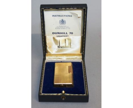 A DUNHILL 70 GOLD COLOURED GAS LIGHTER, No. AV932, in original blue box.