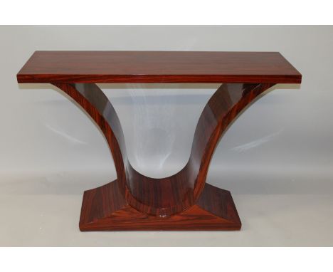 AN ART DECO DESIGN ROSEWOOD CONSOLE TABLE, with a rectangular top on curving supports with shaped base. 3ft 7ins long x 2ft 8