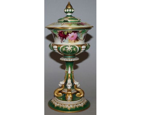 A ROYAL WORCESTER CHALICE AND COVER, painted with panels of flowers by A. SHUCK.  Pattern No. 206H.  10.5ins high.