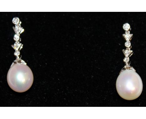 A PAIR OF DIAMOND AND PEARL EARRINGS, set in 18ct white gold.