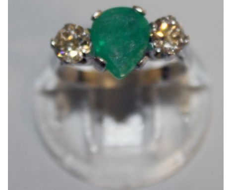 A GOOD PEAR SHAPED EMERALD FLANKED BY DIAMONDS, set in 18ct white gold.