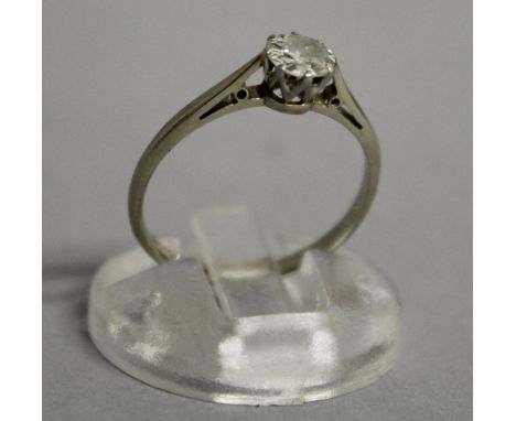 A SOLITAIRE DIAMOND RING in white gold.