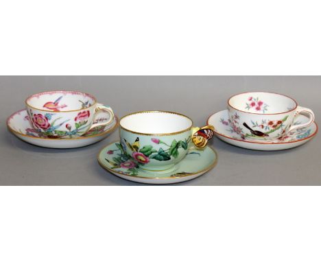 A MINTON BUTTERFLY HANDLED TEA CUP AND SAUCER painted with butterflies and two Minton teacups and saucers painted with birds.