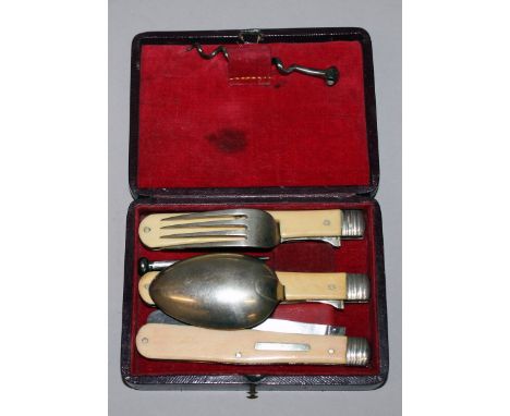 A THREE PIECE KNIFE, FORK AND SPOON SET, in a case.