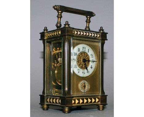 A 19TH CENTURY FRENCH BRASS CARRIAGE CLOCK with alarm.  5ins high.