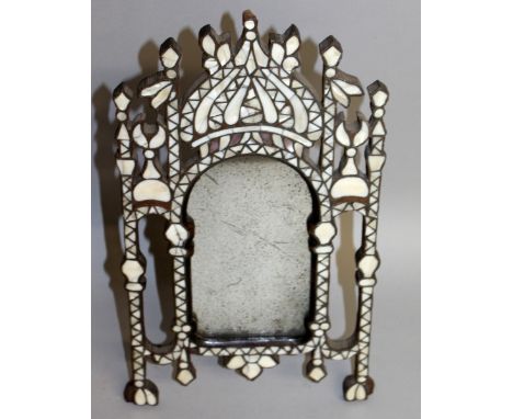 A 19TH CENTURY EASTERN EASEL MIRROR inlaid with mother-of-pearl. 14ins high.