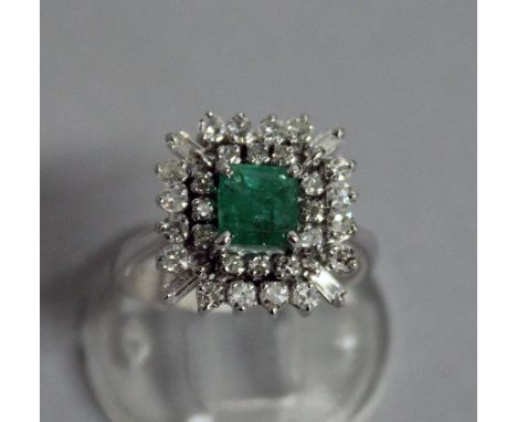 A VERY GOOD EMERALD AND DIAMOND SQUARE CLUSTER DRESS RING, set in white gold.