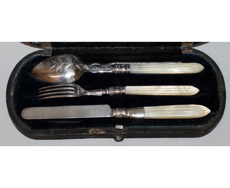 A THREE PIECE VICTORIAN CHRISTENING SET, knife, fork and spoon with silver blades and mother-of-pearl handles, cased. 1900.