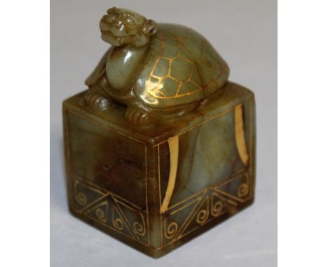 A GOLD INLAID SQUARE JADE SEAL with a turtle handle.  3ins high.