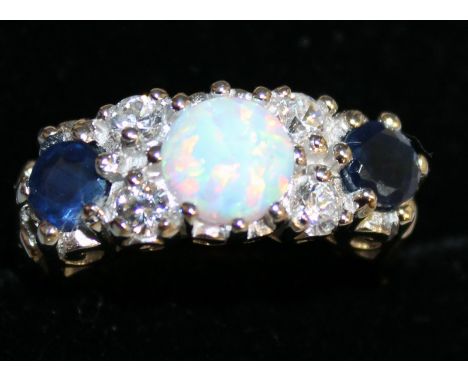 A SAPPHIRE, OPAL AND BRILLIANT RING set in silver.