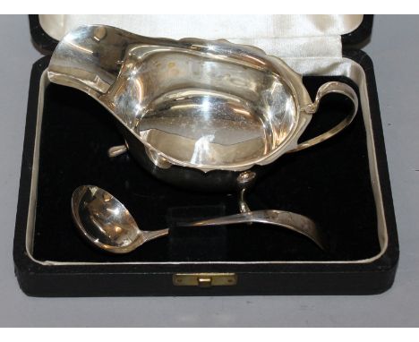 A SAUCEBOAT AND LADLE in a fitted case. Sheffield 1943.