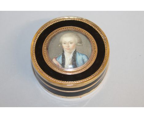 A SUPERB GEORGE III TORTOISESHELL GOLD MOUNTED SNUFF BOX, the lid inset with a portrait miniature, head and shoulders of a yo
