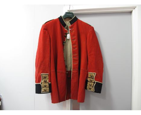 A Bandsman's Red Jacket, with brass lyre buttons, labelled Army and Navy Supply.