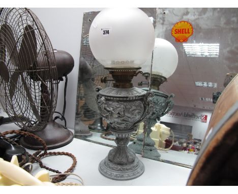 An Early XX Century Oil Lamp, with scroll handles and equestrian figures to white metal base.