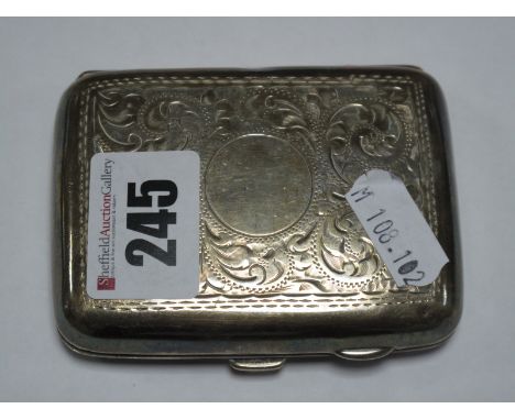 A Hallmarked Silver Cigarette Case, allover leaf scroll engraved.
