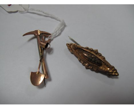 A Bar Brooch, as a pick axe and spade, stamped "South Africa"; together with a 9ct gold bar brooch. (2)