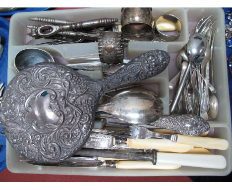 A Silver Backed Mirror, plated napkin rings, cutlery in tray.