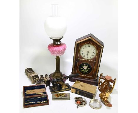 An American mantel clock with painted Roman numeral dial, height 44cm, with a Victorian brass oil lamp with moulded opaque gl