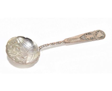 A Chinese white metal caddy spoon decorated with character marks and the bowl decorated with foliage, length 13cm.