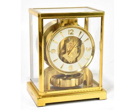 JAEGER LECOULTRE; an Atmos clock, the white dial set with quarter Arabic numerals, height 22cm.Serial number 99798, tarnishin