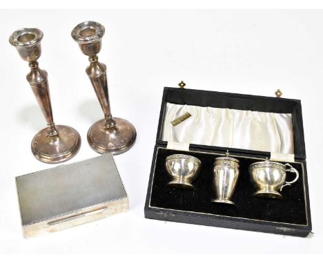  COOPER BROS & SONS LTD; an Elizabeth II hallmarked silver three piece cruet with Celtic knot decoration, Birmingham 1954, to