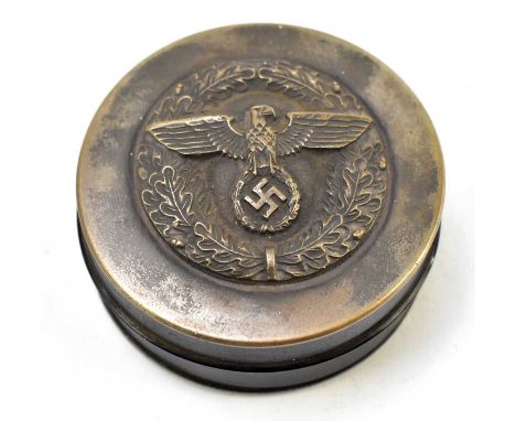 A 19th century metal and papier-mâché snuff box of circular form with later applied Third Reich emblem, diameter 7cm, with in
