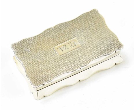 E J TREVITT &amp; SONS; a George V hallmarked silver snuff box of shaped rectangular form with engraved initials surrounding 