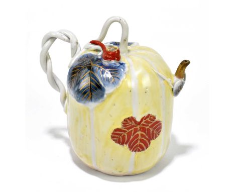 WORCESTER; an 18th century teapot painted in enamels with floral detail, with applied crossover handles, bears Worcester Roya