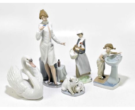 LLADRO; five assorted figures to include a nurse, height 38cm, a model of a swan, etc (5).Light wear throughout but good cond