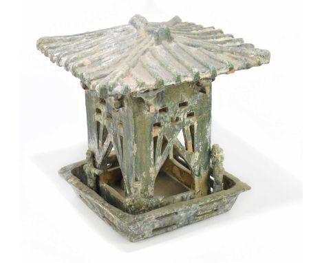 A Chinese Song dynasty (960-1279AD) green glazed model of a tower with four archers positioned at each corner and with ribbed