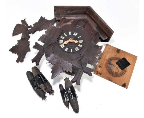 A Black Forest cuckoo clock, the chapter ring set with Roman numerals, height 40cm.Traces of old worm throughout the clock an