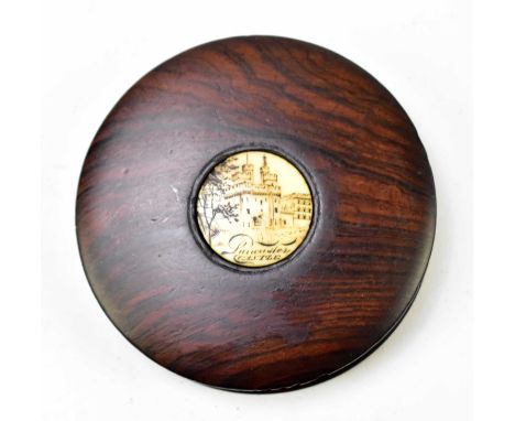 A 19th century rosewood snuff box of circular form with ivory panel, decorated with Lancaster Castle, diameter 9cm. 