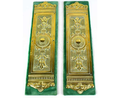 A pair of Regency brass door plates of rectangular form with embossed decoration on later material back panel, approx 31cm (2