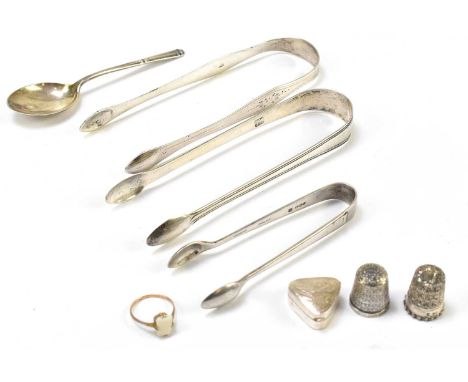 Three pairs of hallmarked silver sugar tongs to include two Georgian pairs, together with two hallmarked silver thimbles to i