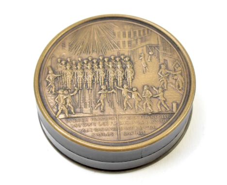 A 19th century French metal and lacquered snuff box of circular form depicting guards at Versailles, diameter 7.5cm.The box o