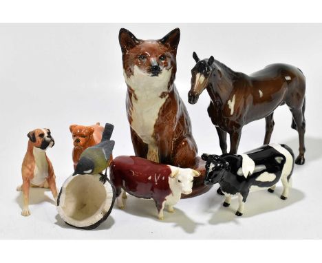 BESWICK; a collection of figures to include model of a fireside fox, number 2348, height 30cm, together with a Beswick Friesi