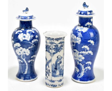 Two Chinese blue and white vases with covers, each decorated with cracked ice and prunus blossom, one with four character mar